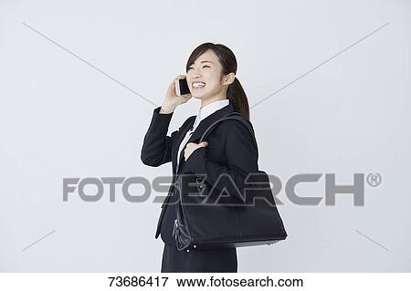 Stock Photo - Japanese businesswoman on white background. Fotosearch