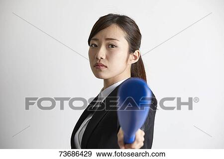 Stock Photo - Japanese businesswoman on white background. Fotosearch
