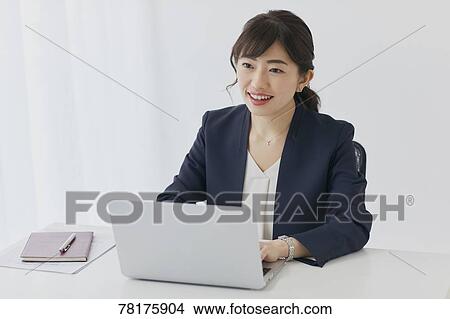 Picture - Japanese businesswoman working. Fotosearch
