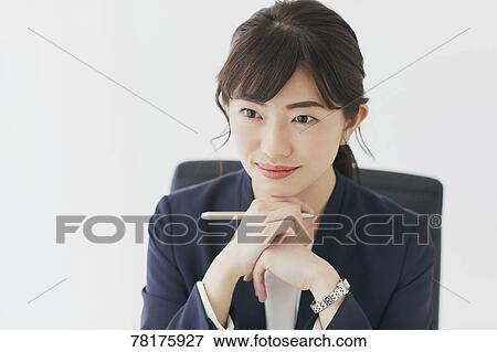 Stock Photo - Japanese businesswoman working. Fotosearch