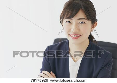 Stock Photograph - Japanese businesswoman working. Fotosearch