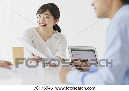 Stock Photography - Japanese businesswoman working. Fotosearch