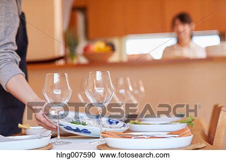 Japanese couple cooking together in the kitchen View Large Photo Image Stock Image - Japanese couple cooking together in the kitchen. Fotosearch