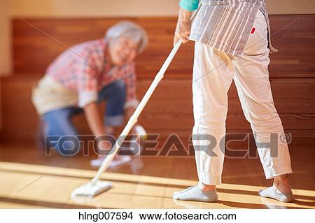 Japanese couple doing housework View Large Photo Image Picture - Japanese couple doing housework. Fotosearch
