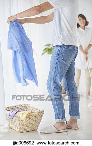 Japanese couple doing housework View Large Photo Image Stock Image - Japanese couple doing housework. Fotosearch