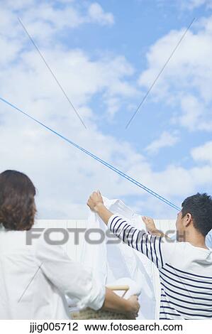 Japanese couple doing housework View Large Photo Image Stock Image - Japanese couple doing housework. Fotosearch