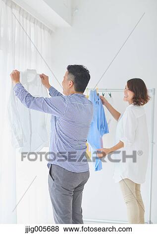 Japanese couple doing housework View Large Photo Image Stock Photo - Japanese couple doing housework. Fotosearch