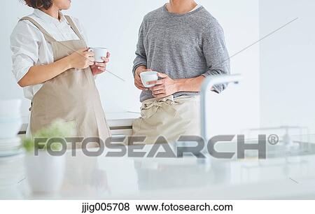 Japanese couple doing housework View Large Photo Image Stock Photo - Japanese couple doing housework. Fotosearch