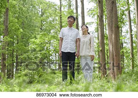 Japanese couple in a city park View Large Photo Image Picture - Japanese couple in a city park. Fotosearch