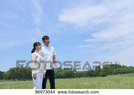Japanese couple in a city park View Large Photo Image Picture - Japanese couple in a city park. Fotosearch