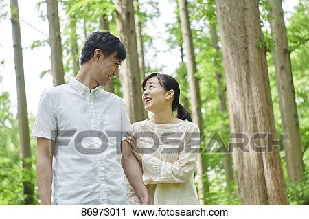 Japanese couple in a city park View Large Photo Image Stock Image - Japanese couple in a city park. Fotosearch