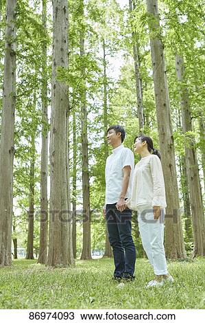 Japanese couple in a city park View Large Photo Image Stock Image - Japanese couple in a city park. Fotosearch