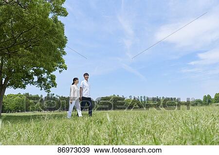 Japanese couple in a city park View Large Photo Image Stock Photo - Japanese couple in a city park. Fotosearch