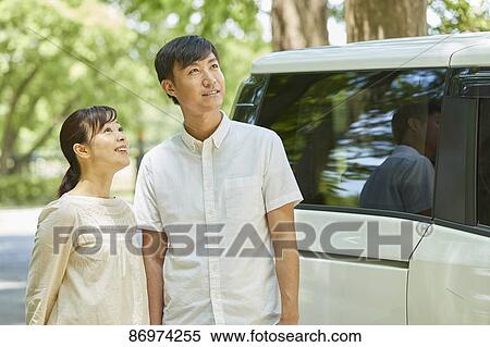 Japanese couple in a city park View Large Photo Image Stock Photography - Japanese couple in a city park. Fotosearch