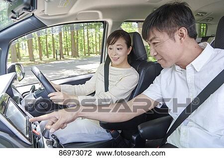 Japanese couple in the car View Large Photo Image Stock Image - Japanese couple in the car. Fotosearch