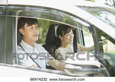 Japanese couple in the car View Large Photo Image Stock Image - Japanese couple in the car. Fotosearch