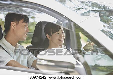 Japanese couple in the car View Large Photo Image Stock Image - Japanese couple in the car. Fotosearch