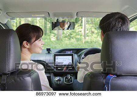 Stock Photo - Japanese couple in the car. Fotosearch