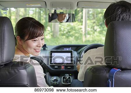 Japanese couple in the car View Large Photo Image Stock Photo - Japanese couple in the car. Fotosearch