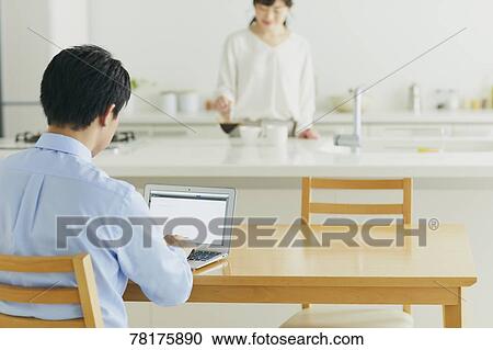 Japanese couple in the kitchen View Large Photo Image Stock Image - Japanese couple in the kitchen. Fotosearch
