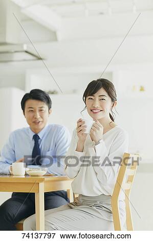Stock Photo - Japanese couple in the kitchen. Fotosearch