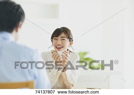 Stock Photo - Japanese couple in the kitchen. Fotosearch