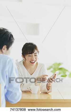 Stock Photo - Japanese couple in the kitchen. Fotosearch