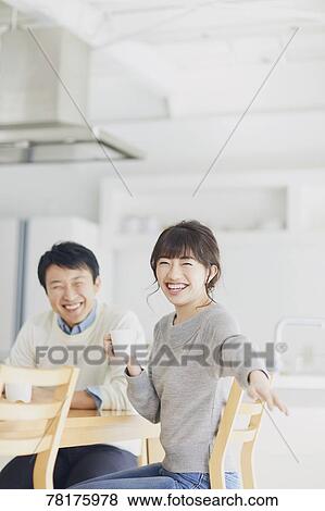 Stock Photo - Japanese couple in the kitchen. Fotosearch