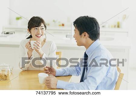 Stock Photography - Japanese couple in the kitchen. Fotosearch