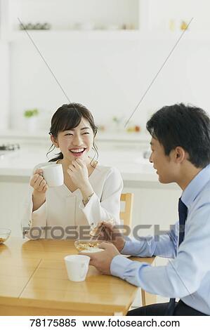 Stock Photography - Japanese couple in the kitchen. Fotosearch