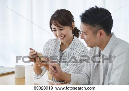Japanese couple in the living room View Large Photo Image Stock Photo - Japanese couple in the living room. Fotosearch