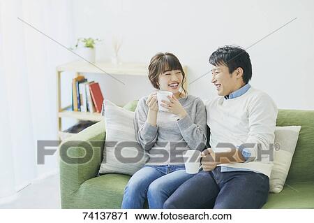 Japanese couple on the sofa View Large Photo Image Stock Image - Japanese couple on the sofa. Fotosearch