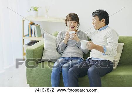 Japanese couple on the sofa View Large Photo Image Stock Image - Japanese couple on the sofa. Fotosearch