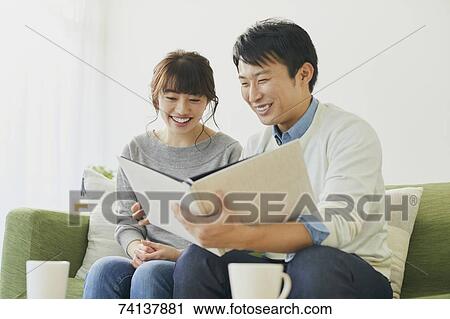 Japanese couple on the sofa View Large Photo Image Stock Image - Japanese couple on the sofa. Fotosearch