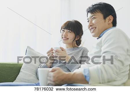 Japanese couple on the sofa View Large Photo Image Stock Image - Japanese couple on the sofa. Fotosearch