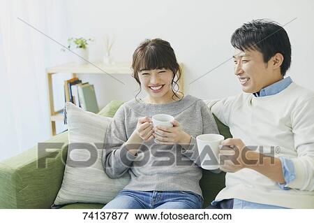 Japanese couple on the sofa View Large Photo Image Stock Photo - Japanese couple on the sofa. Fotosearch