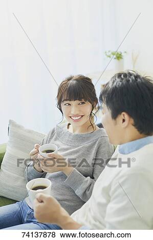 Japanese couple on the sofa View Large Photo Image Stock Photo - Japanese couple on the sofa. Fotosearch