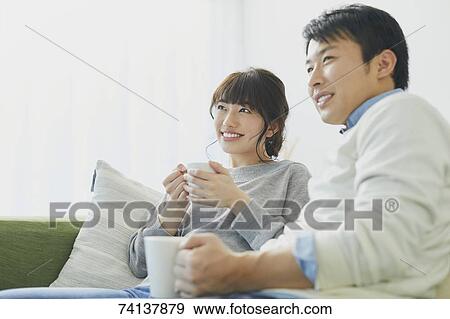 Japanese couple on the sofa View Large Photo Image Stock Photo - Japanese couple on the sofa. Fotosearch