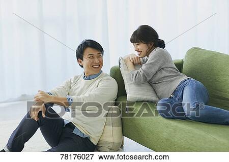 Japanese couple on the sofa View Large Photo Image Stock Photo - Japanese couple on the sofa. Fotosearch