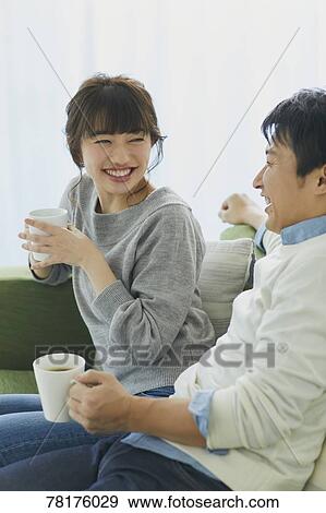Japanese couple on the sofa View Large Photo Image Stock Photo - Japanese couple on the sofa. Fotosearch