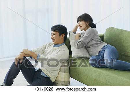 Japanese couple on the sofa View Large Photo Image Stock Photograph - Japanese couple on the sofa. Fotosearch