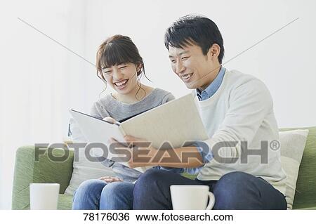 Japanese couple on the sofa View Large Photo Image Stock Photograph - Japanese couple on the sofa. Fotosearch