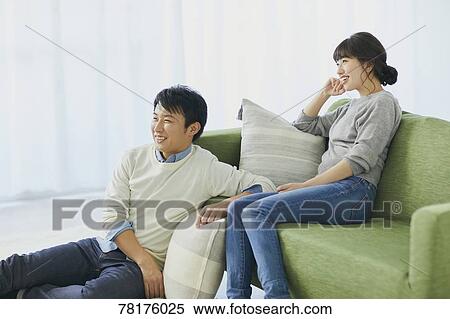Japanese couple on the sofa View Large Photo Image Stock Photography - Japanese couple on the sofa. Fotosearch