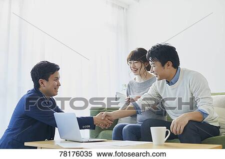 Japanese couple talking with salesman View Large Photo Image Stock Photography - Japanese couple talking with salesman. Fotosearch