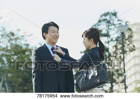 Japanese couple walking to work View Large Photo Image Picture - Japanese couple walking to work. Fotosearch