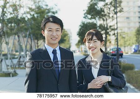 Japanese couple walking to work View Large Photo Image Stock Photo - Japanese couple walking to work. Fotosearch