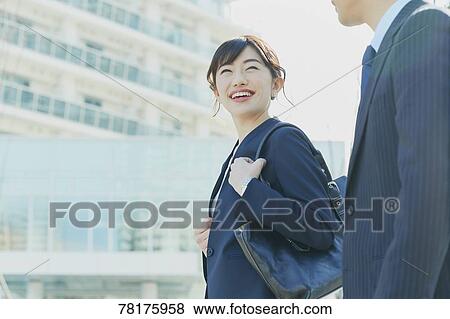 Stock Photo - Japanese couple walking to work. Fotosearch