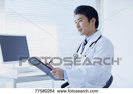 Picture - Japanese doctor in his studio. Fotosearch