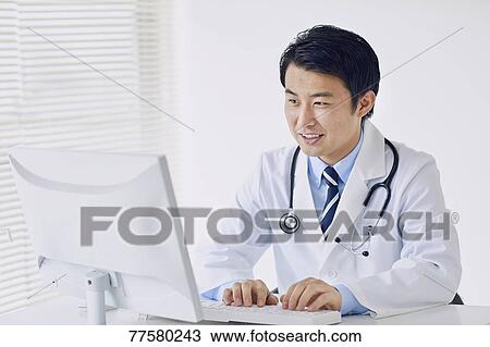 Stock Image - Japanese doctor in his studio. Fotosearch