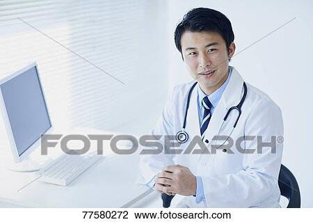 Stock Image - Japanese doctor in his studio. Fotosearch